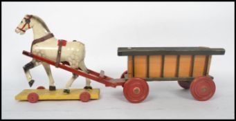 An early 20th century decorative children's wooden