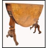 A good  Victorian 19th century burr walnut Sutherland table with half moon  drop leaves being raised