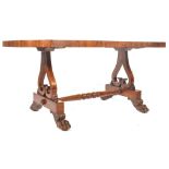 A large 19th century Regency Irish / Scottish rosewood library table desk being raisaed on pierced