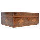 A 19th century Victorian walnut work box having a marquetry top with inset diamond shaped burr maple