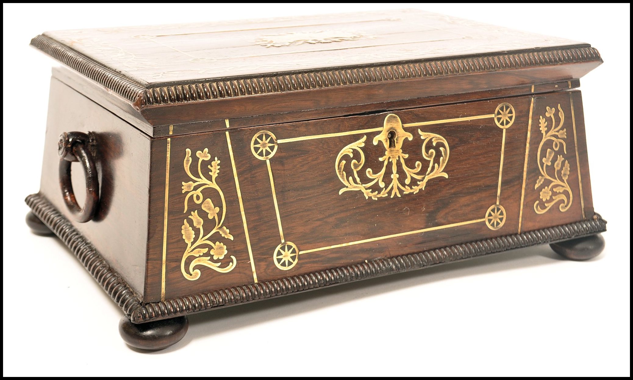 A Regency rosewood brass inlaid work box raised on bun feet with gadrooned edges. Loop handles to - Image 6 of 10