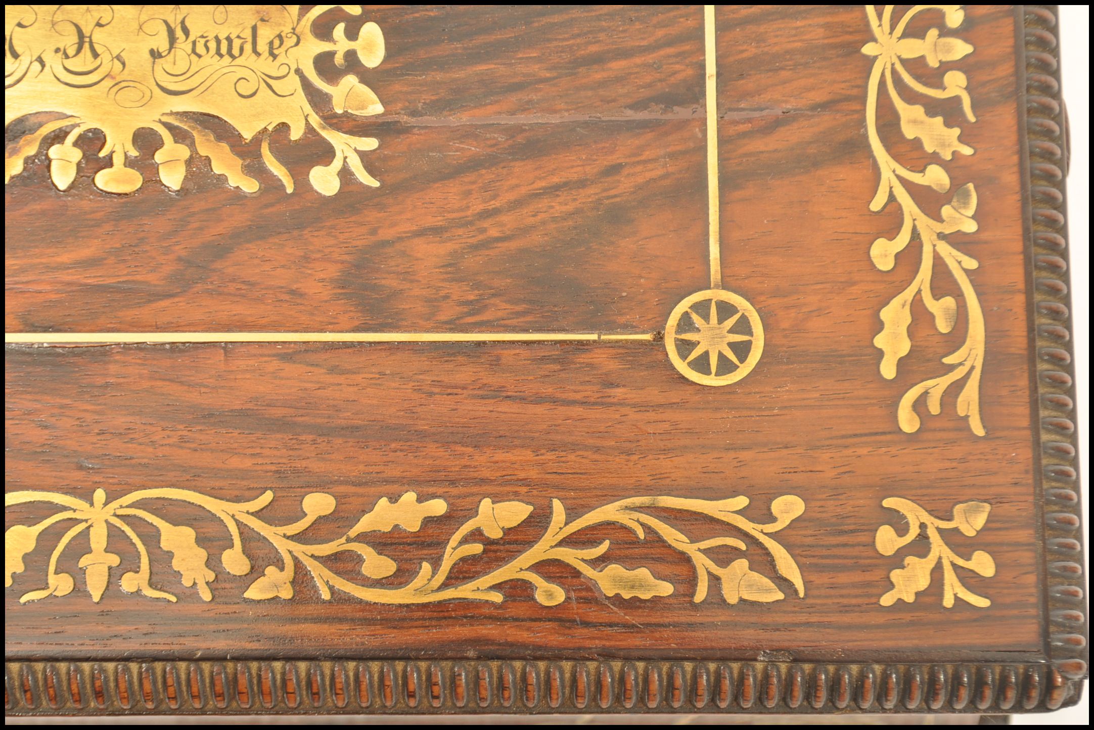 A Regency rosewood brass inlaid work box raised on bun feet with gadrooned edges. Loop handles to - Image 10 of 10