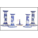 A 19th century Wedgwood Jasperwatre cameoware dressing table set consisting of two pairs of cobalt