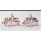 A pair of 19th century Victorian silver plated tureens raised on scrolled acanthus feet with foliage