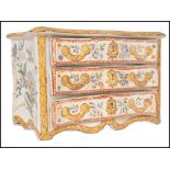 A 19th century Faience handpainted serpentine fronted commode chest of drawers jewellery box