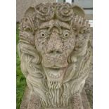 An exquisitely carved  large 20th Century reconstituted stone recumbent Lion. The detailed head of