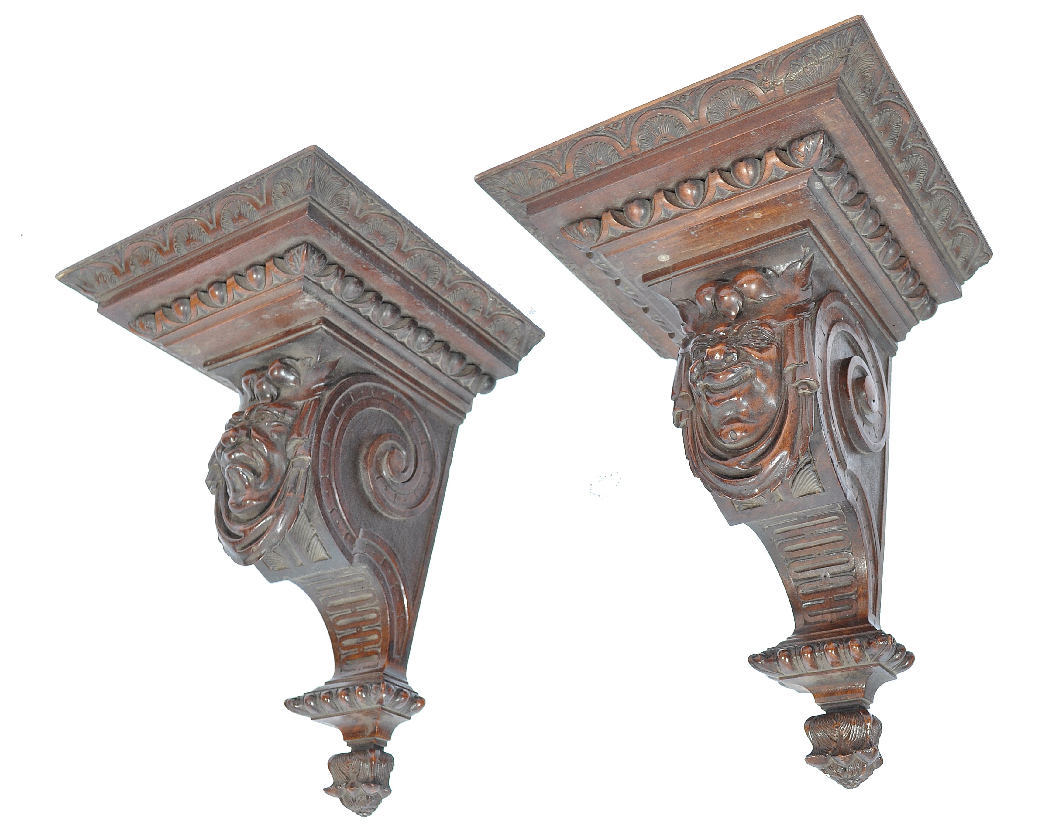 A pair of 19th century large solid walnut carved w