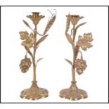 A pair of 19th century French gilt brass ormolu candlesticks raised on a six shell bases with