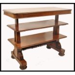 A 19th century Regency mahogany metamorphic two tier library table. Circa 1825, the table raised