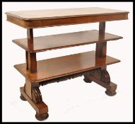 A 19th century Regency mahogany metamorphic two tier library table. Circa 1825, the table raised