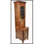 A 19th century French pedestal country oak library bookcase cabinet. The base with single locker