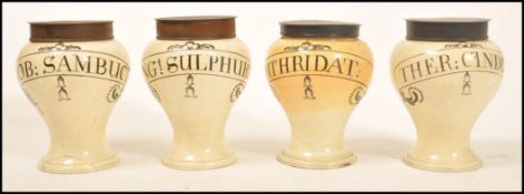 A set of 18th century Georgian Wedgwood Queensware apothecary drug jars of bulbous form raised on