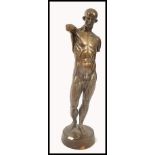 A 20th century large Italian nude bronze statue of an anatomical man in manner of Leonardo Da Vinci.
