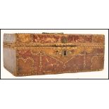 A 18th century Georgian Moroccan leather studded box stained red and brown with brass lion mask to