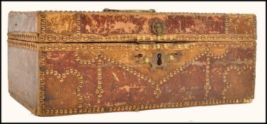 A 18th century Georgian Moroccan leather studded box stained red and brown with brass lion mask to