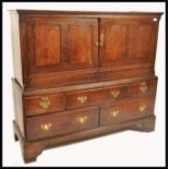 An 18th century oak housekeepers livery cupboard. The beautiful oak with crossbanded mahogany