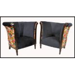 A stunning pair of Art Deco mahogany upholstered bergere armchairs  in the manner of Paul Follot