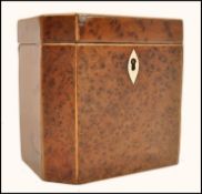 An 18th century Burr Yew wood Georgian tea caddy of octagonal form with ivory key escutcheon. Hinged