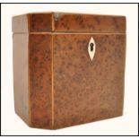 An 18th century Burr Yew wood Georgian tea caddy of octagonal form with ivory key escutcheon. Hinged