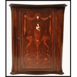 A 19th century rosewood marquetry and bone inlaid hanging corner cabinet. The door with stunning