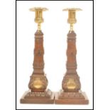 A pair of Masonic carved wooden souvenir candlestick with cast brass sockets, the base of each