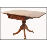 A good 19th century Regency solid mahogany drop leaf sofa table, Raised on reeded splayed legs