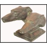 A 20th century large bronzed terracotta studio pottery diorama bust study of a pair of greyhounds