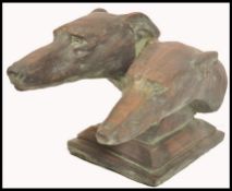 A 20th century large bronzed terracotta studio pottery diorama bust study of a pair of greyhounds