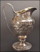 An 18th century George 3rd silver ewer / jug by maker Paul Storr, London, 1793. The ewer raised on