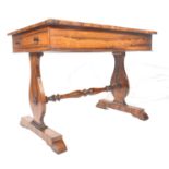 A 19th century Regency rosewood writing table desk being raised on lyre shaped supports united by