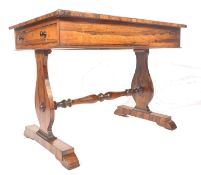 A 19th century Regency rosewood writing table desk being raised on lyre shaped supports united by