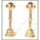 A pair of believed Pugin 19th century Victorian heavy brass candlesticks of hexagonal column form