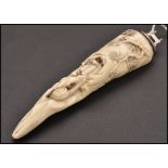 A 19th century Chinese silver mounted marine ivory tusk carved with a wasp on bamboo, snail