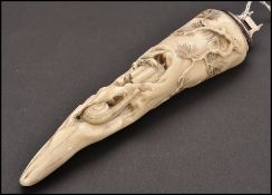 A 19th century Chinese silver mounted marine ivory tusk carved with a wasp on bamboo, snail