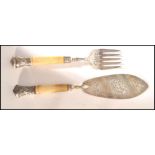 A pair of 19th century Victorian bone and silver hallmarked handled fish knife and fork set. The