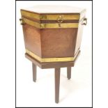 A 19th century George 3rd brass bound mahogany wine cooler on stand. Of hexagonal form  with