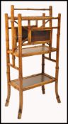 A 19th century Victorian aesthetic movement bamboo Canterbury magazine stand having a lacquered