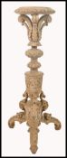 A 19th century Victorian carved and limed oak bust stand / plant stand. Profusely carved with c-