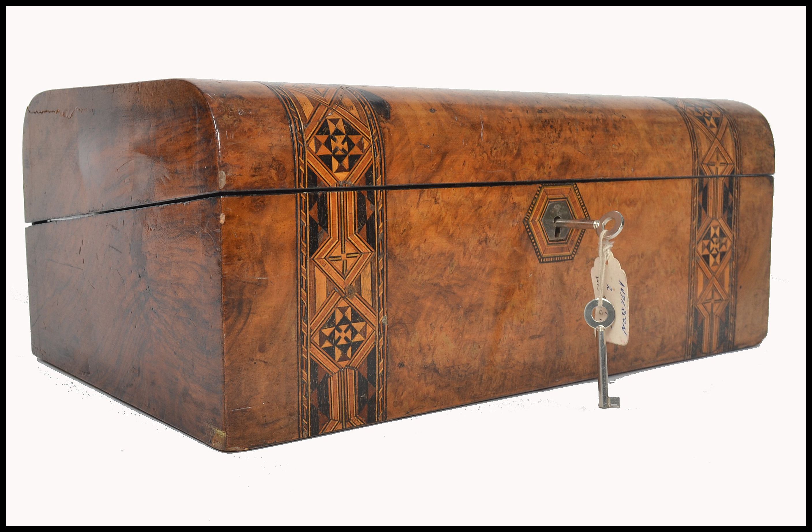 A 19th century walnut tunbridge inlaid dome top writing box. The inlaid tunbridge marquetry