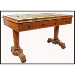 A Regency 19th century burr oak library table - writing table desk having a green leather writing