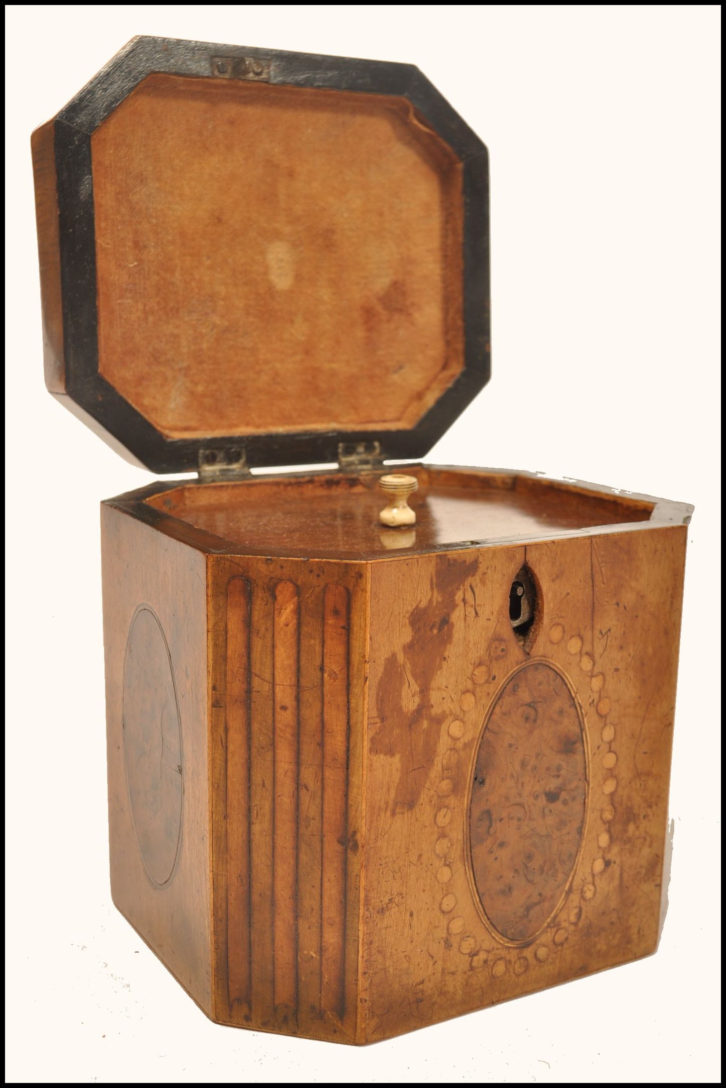 An 18th century Georgian walnut tea caddy having yew wood oval panels and box wood inlays. The