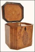 An 18th century Georgian walnut tea caddy having yew wood oval panels and box wood inlays. The