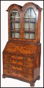 An 18th century Dutch walnut and marquetry inlaid bureau bookcase. The bureau with stunning floral