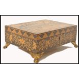 A 19th century penwork Chinese workbox being beatifully decorated with floral sprays and geometric