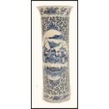 A 19th century Chinese blue and white ceramic vase of tall form having a flared rim. Hand painted