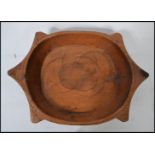 A large antique Ethnic carved wooden serving bowl