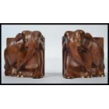 A pair of early 20th century hard wood bookends mo