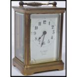 An early 20th century brass carriage clock with en
