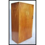 A 1930's Art Deco walnut bachelors wardrobe. Of sm