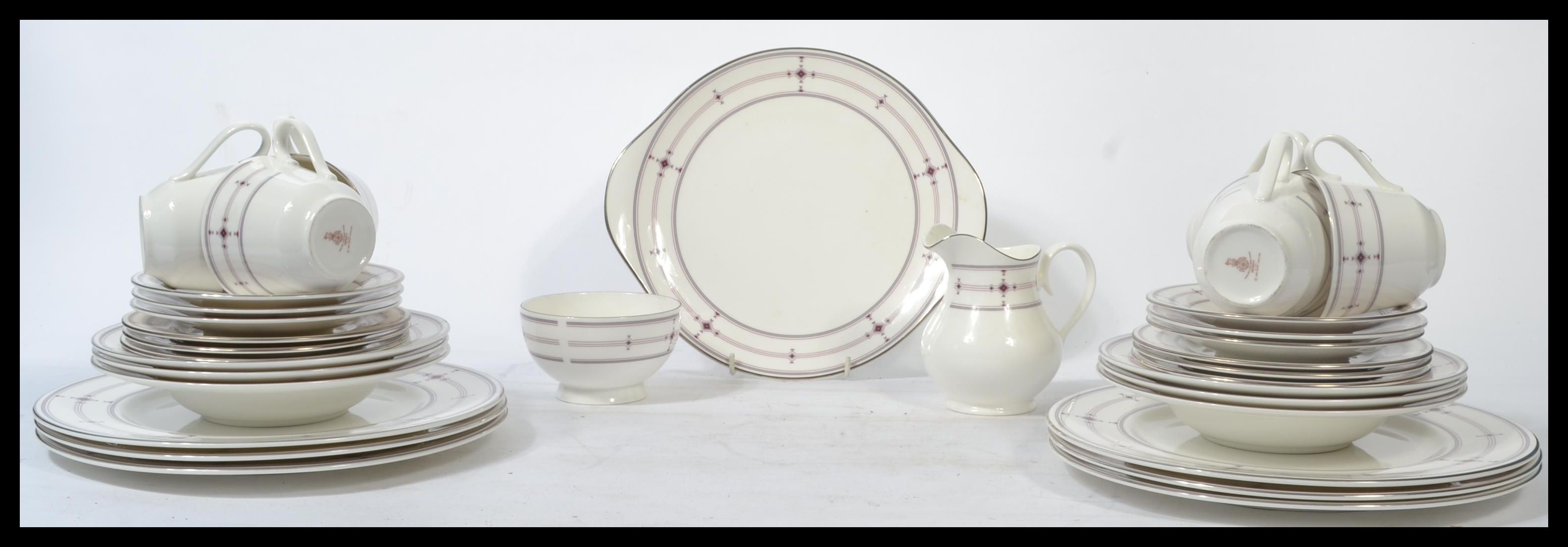A Royal Doulton tea and dinner service in the Infi